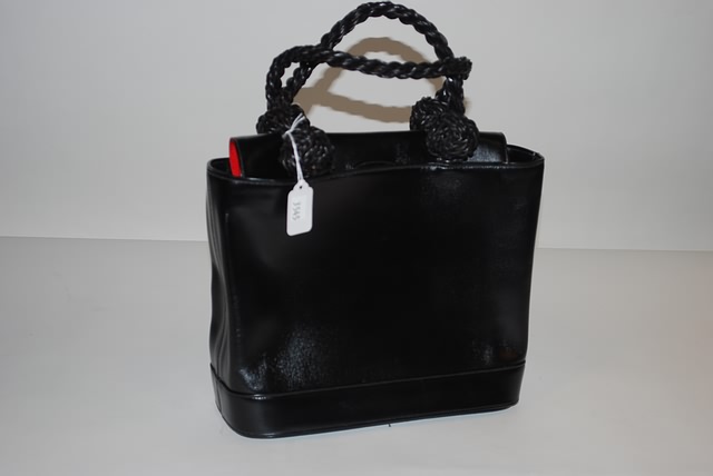 Appraisal: Renaud Pellegrino Black leather bag with large knotted woven handles