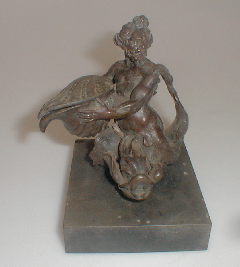 Appraisal: An Antique bronze figure of Triton seated on a dolphin