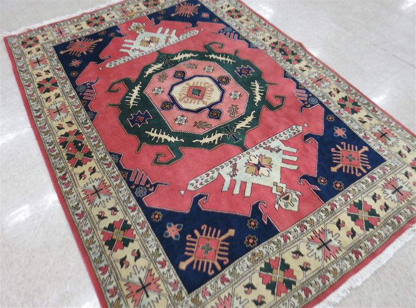 Appraisal: HAND KNOTTED ORIENTAL AREA RUG Indo-Caucasian featuring a geometric central