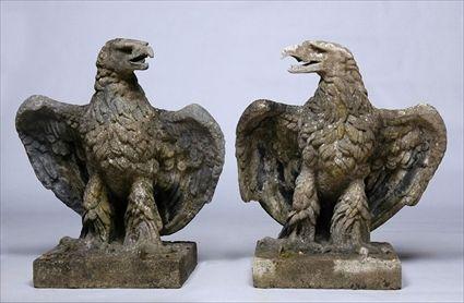 Appraisal: PAIR OF ARTIFICIAL STONE EAGLE PIER FINIALS On square section