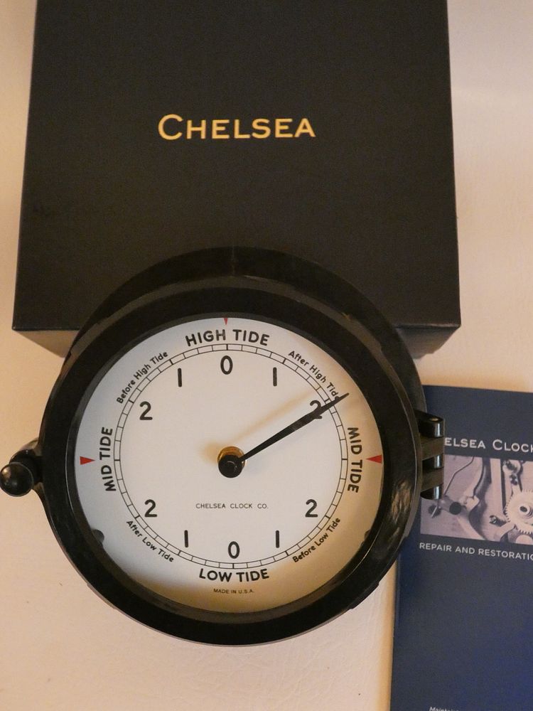 Appraisal: CHELSEA TIDE CLOCK Modern Chelsea composition black quartz porthole-style tide