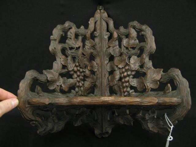 Appraisal: Black Forest Victorian Carved Wooden Corner Shelf elaborate grape vine