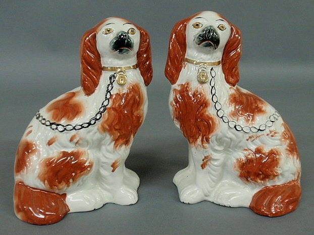 Appraisal: Pair of Staffordshire seated red Spaniels c h x w