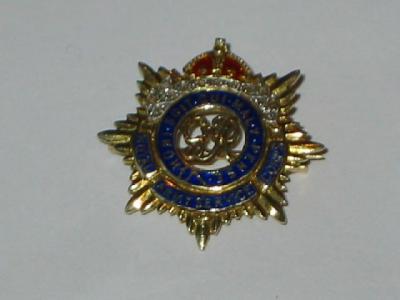 Appraisal: A CT GOLD MILITARY BROOCH the centre pierced with G