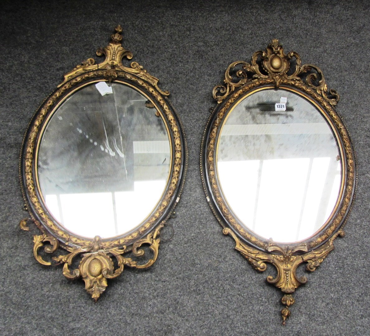 Appraisal: A pair of th century gilt framed oval wall mirrors