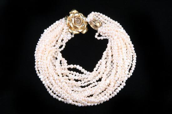 Appraisal: MULTI-STRAND FRESH WATER PEARL NECKLACE SYLVIA GOTTWALD White freshwater pearls