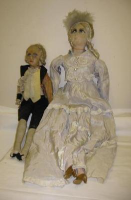 Appraisal: A French boudoir doll with moulded and painted fabric face