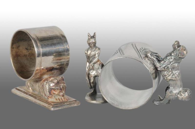 Appraisal: Lot of Figural Napkin Rings Description Includes a small lying