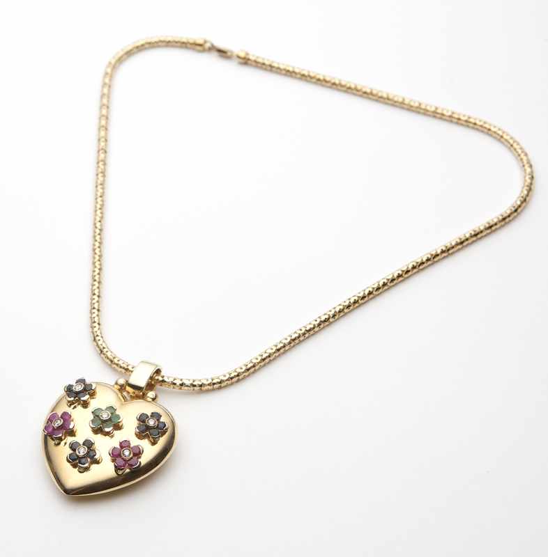 Appraisal: A gem-set and gold heart pendant with gold chain K