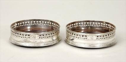 Appraisal: Pair of George III Silver Bottle Coasters with Turned Wood