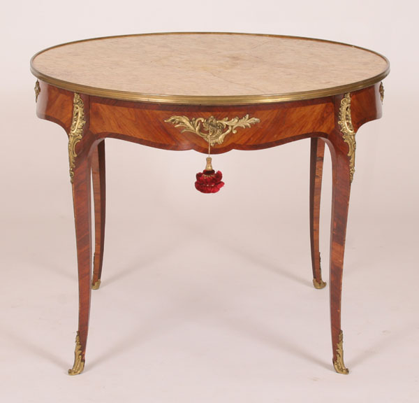 Appraisal: French style parquetry parlor table ormolu mounts adorned saber legs