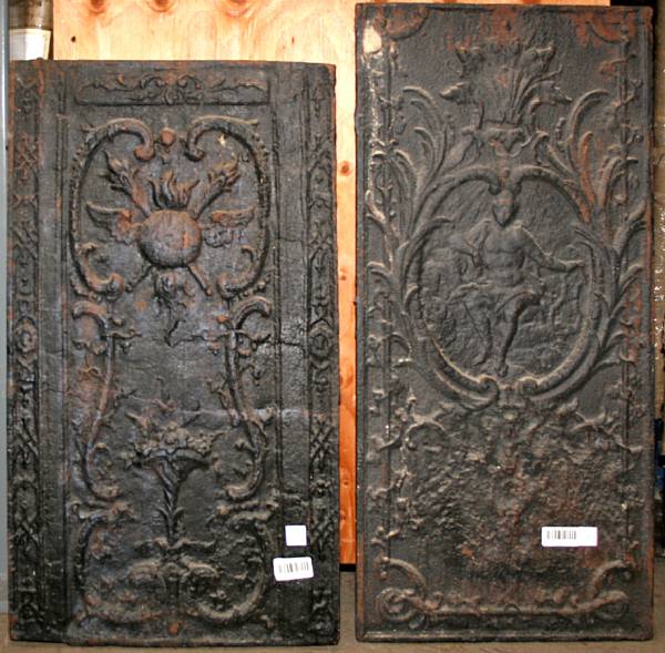 Appraisal: Two cast iron fire backs The first decorated with a