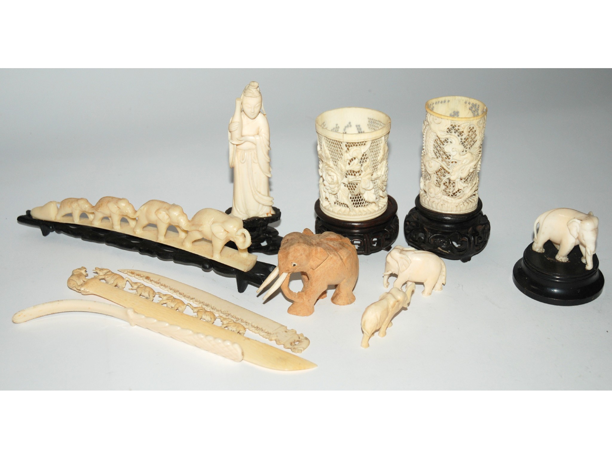 Appraisal: A collection of carved bone elephants and caved figure