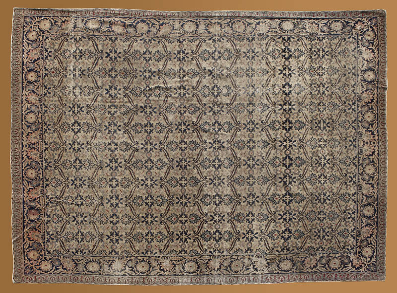 Appraisal: A Persian Kirman woolen carpet rug A Persian Kirman woolen