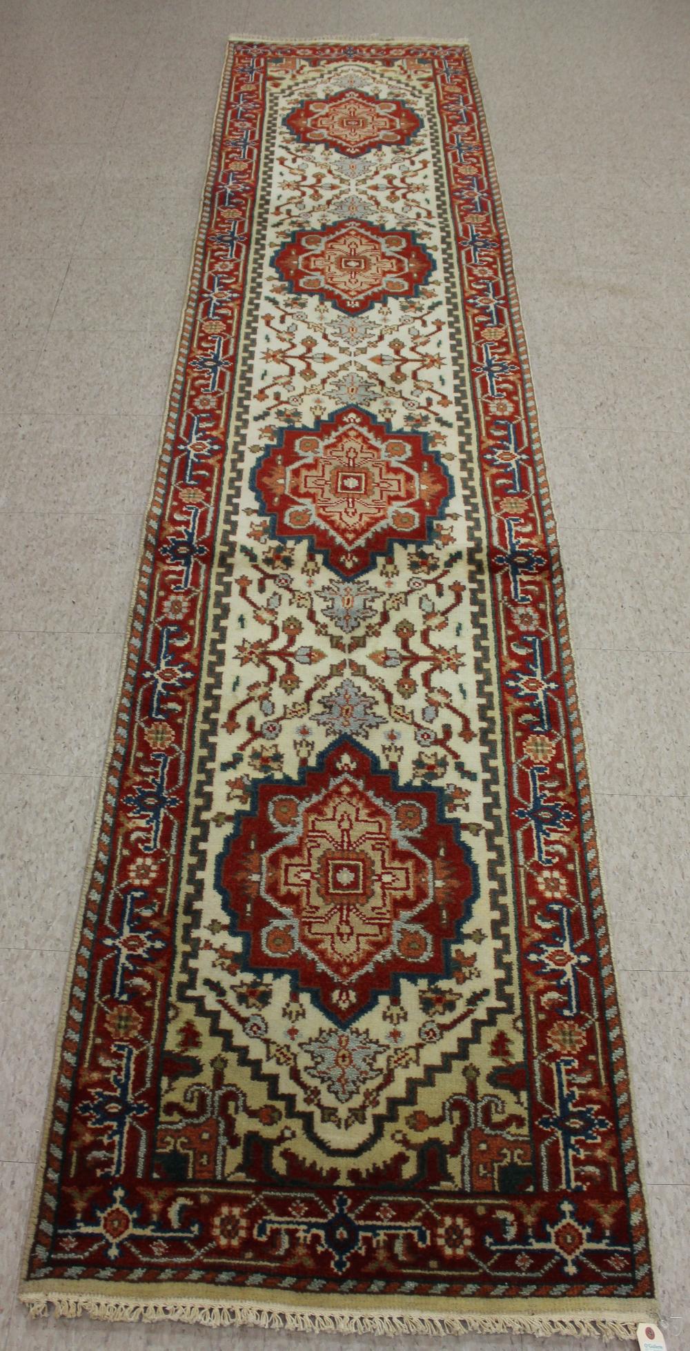 Appraisal: HAND KNOTTED ORIENTAL HALL RUG Persian Serab design featuring four