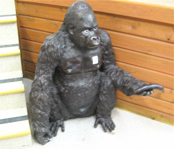 Appraisal: LARGE BRONZE WILDLIFE SCULPTURE the study of a gorilla in