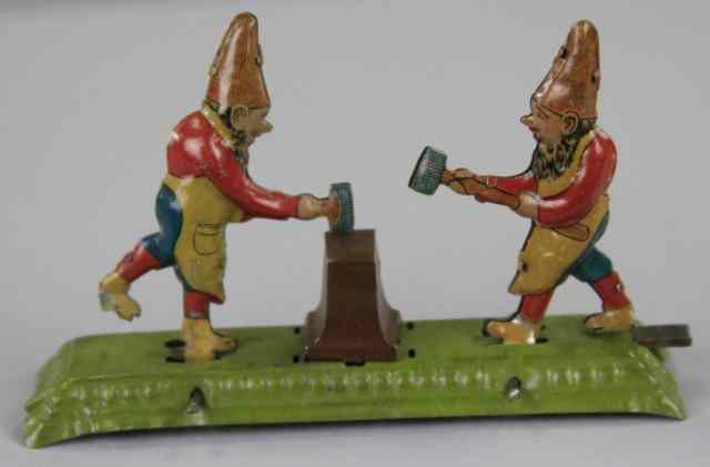 Appraisal: MEIER GNOMES HITTING ANVIL PENNY TOY Germany lithographed tin depicts