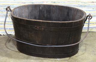 Appraisal: Hoop-and-stave constructed oval bucket with swing bail wrought-iron handle h