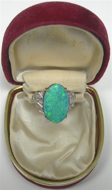 Appraisal: A black opal doublet and diamond set ring the central