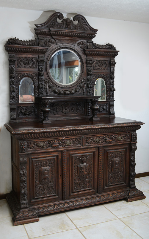 Appraisal: LARGE BELGIAN CARVED OAK STEPBACK CUPBOARD SIDEBOARD Masqueron carved scrolled