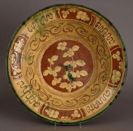 Appraisal: ENGLISH SLIPWARE POTTERY BASIN The interior with central floral rondel