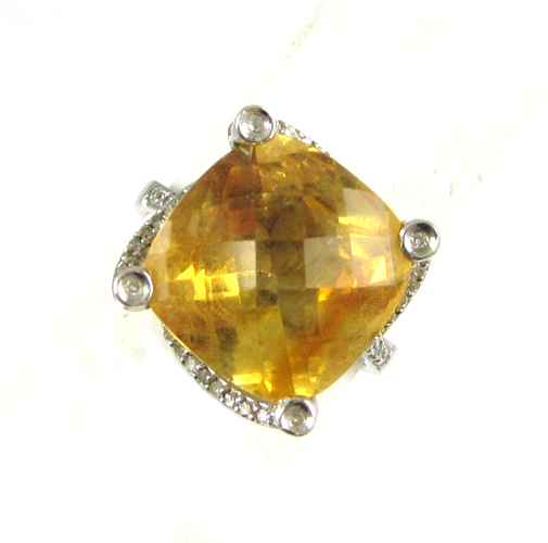 Appraisal: CITRINE DIAMOND AND FOURTEEN KARAT GOLD RING The white gold