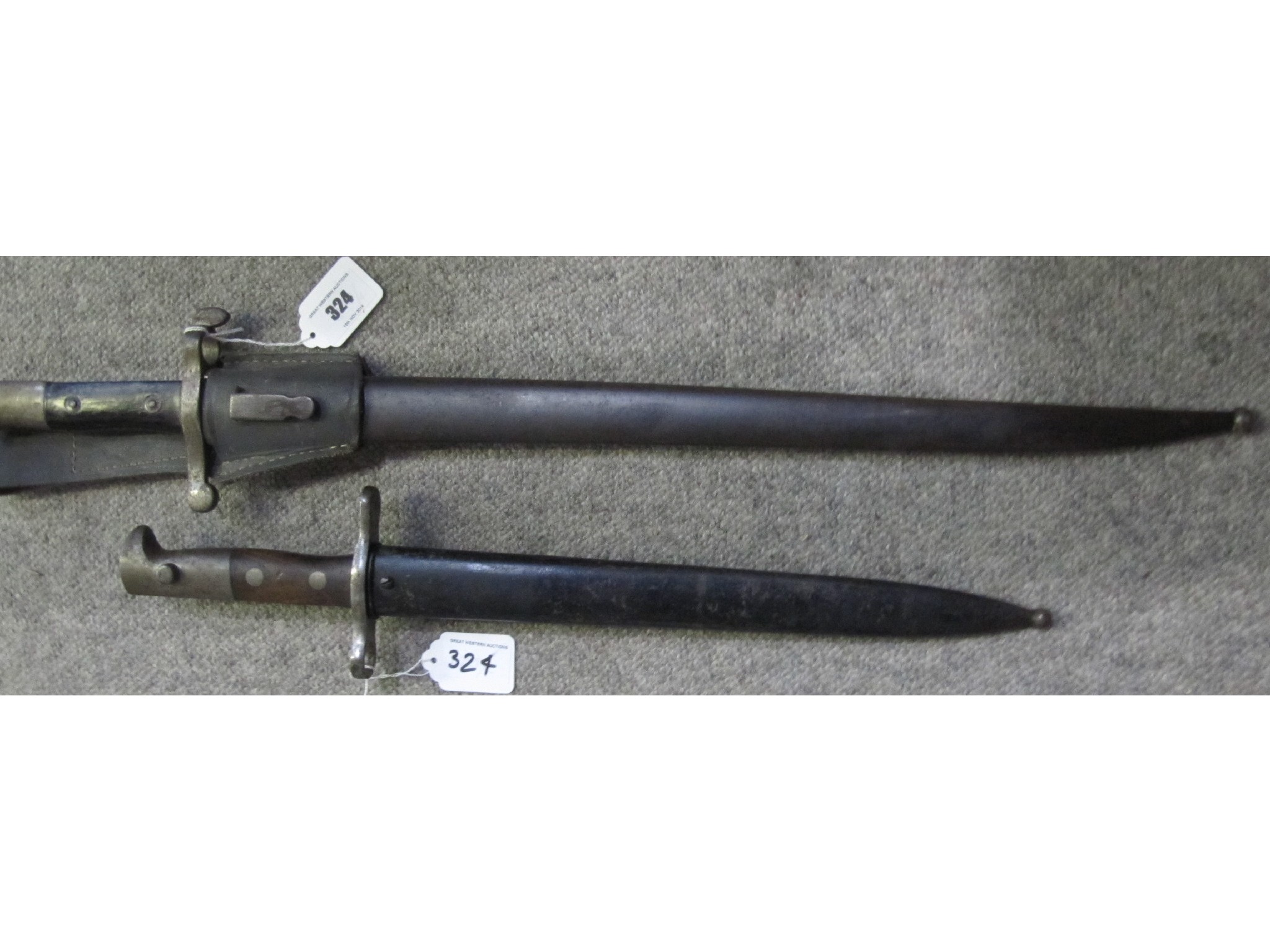 Appraisal: A lot comprising two bayonets in scabbards - Swiss and