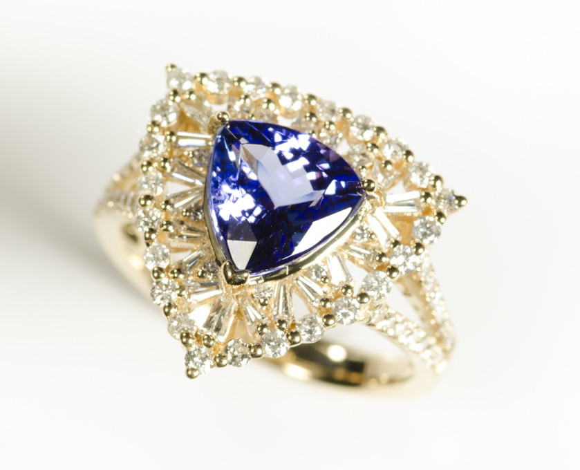 Appraisal: TANZANITE DIAMOND AND FOURTEEN KARAT GOLD RING with round-cut and