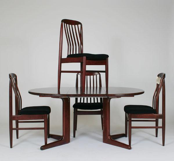 Appraisal: Modern rosewood dining table and chairs pedestal base one leaf