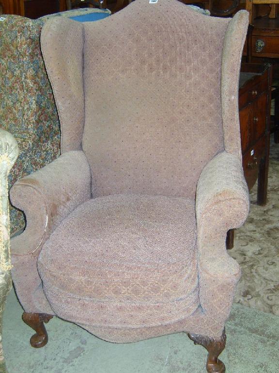 Appraisal: A Georgian style wing easy chair with beige upholstery and