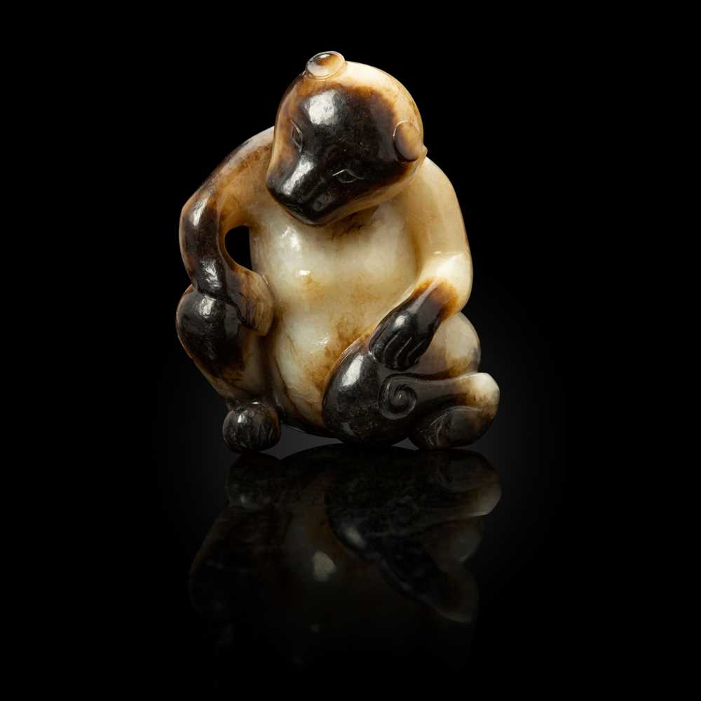 Appraisal: WHITE JADE WITH RUSSET SKIN CARVING OF A SEATED BEAR