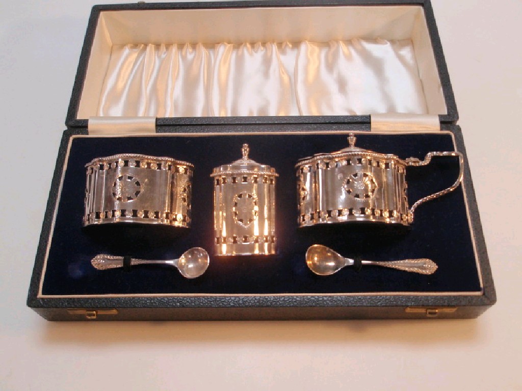 Appraisal: A cased Georgian style pierced silver three-piece cruet set with