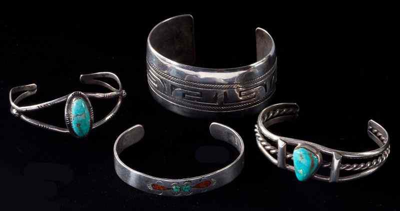 Appraisal: Four Native American Silver Cuff Braceletsincluding three Navajo examples the