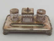 Appraisal: A Russian silver plated inkstand on four scrolling feet with