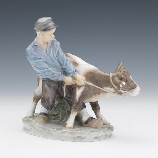 Appraisal: ROYAL COPENHAGEN BOY WITH CALF FIGURINE x x Royal Copenhagen