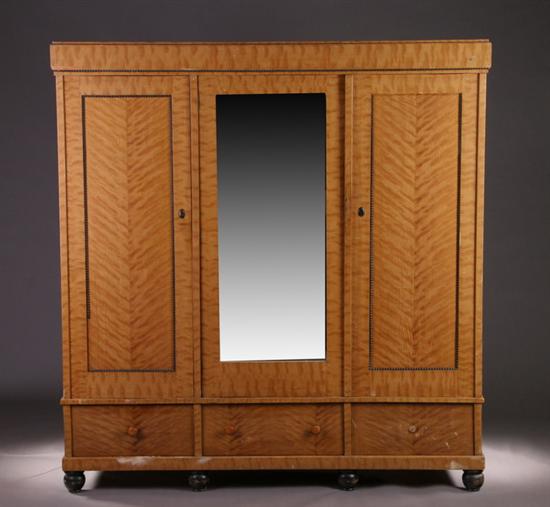 Appraisal: BIEDERMEIER STYLE PINE THREE-DOOR WARDROBE - Each grain-painted paneled door