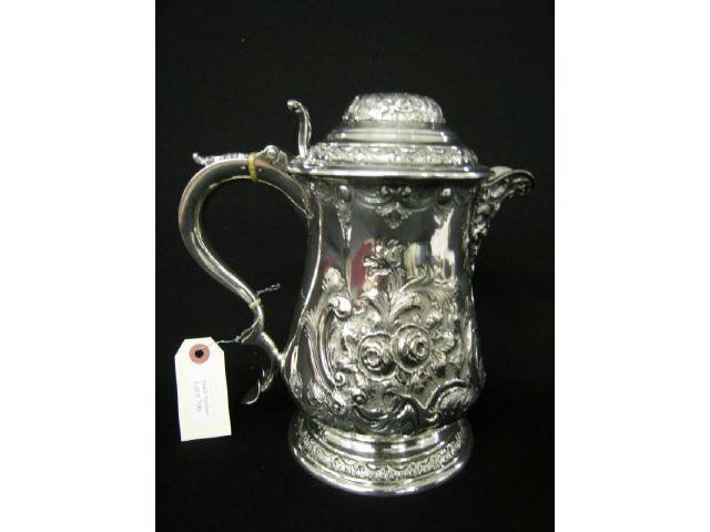 Appraisal: th Century English Silverplate Tankard figural man spout elaborate floral