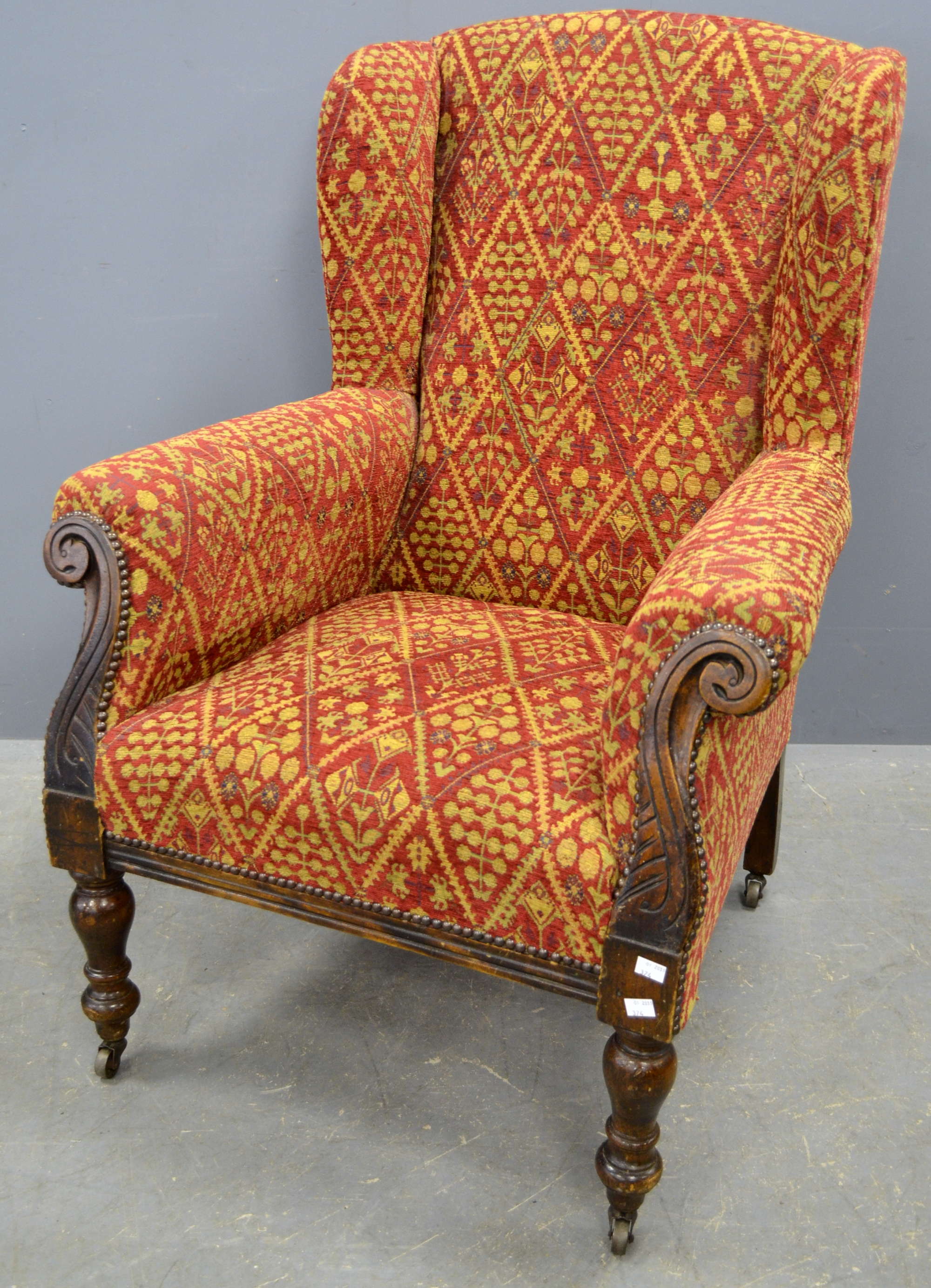 Appraisal: Oak framed and upholstered wing back armchair