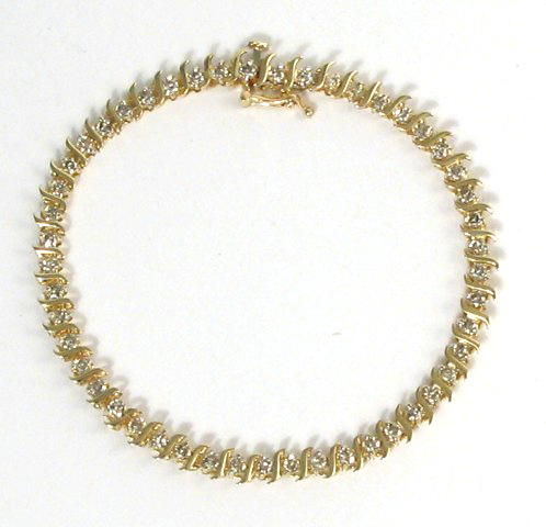 Appraisal: DIAMOND AND FOURTEEN KARAT GOLD BRACELET in length and set