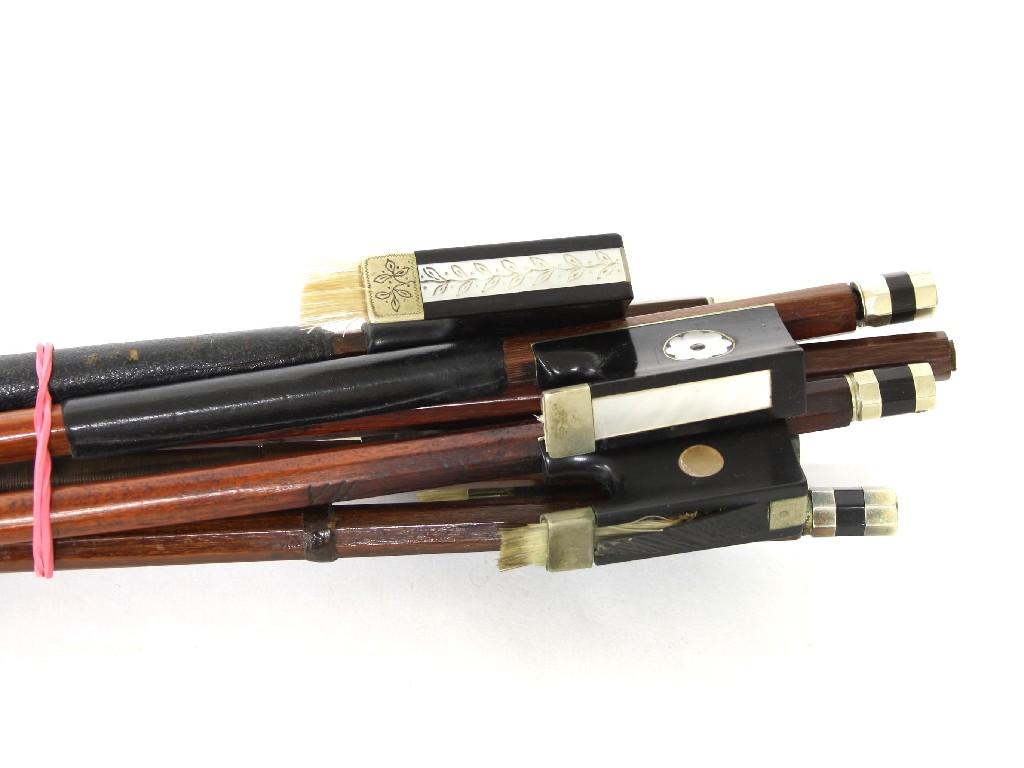 Appraisal: Five nickel mounted violin bows and a bow stick