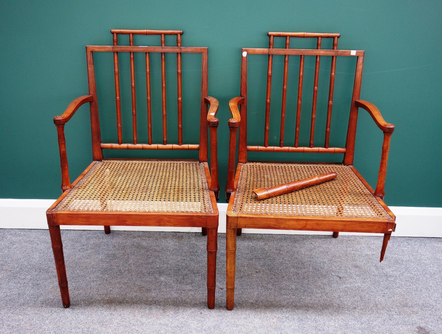 Appraisal: A pair of Regency satinwood open armchairs with faux turned