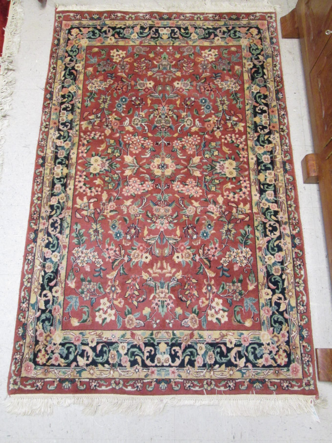 Appraisal: HAND KNOTTED ORIENTAL AREA RUG Indo-Persian overall floral design on