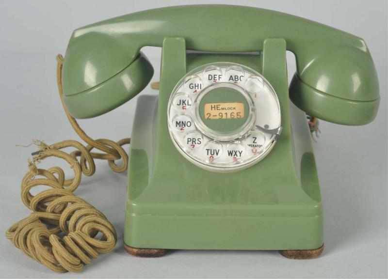 Appraisal: Western Electric Green Cradle Telephone Plastic shell and base dated