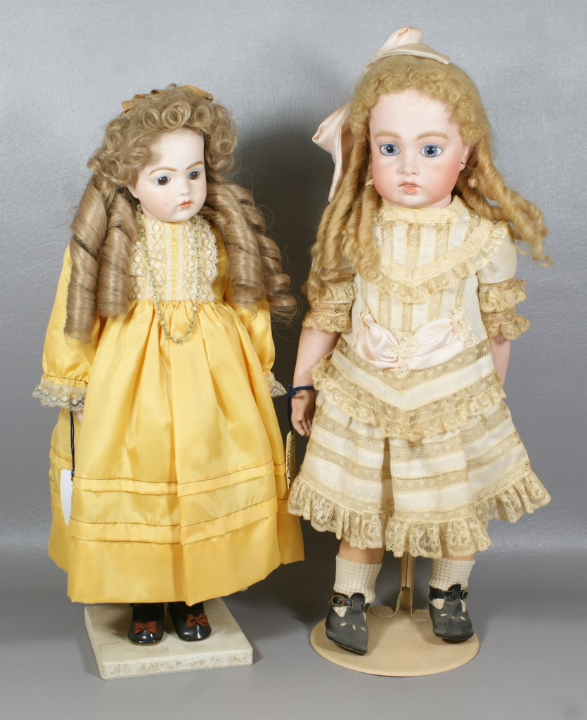 Appraisal: Reproduction Bru Dolls the larger is a replica of a