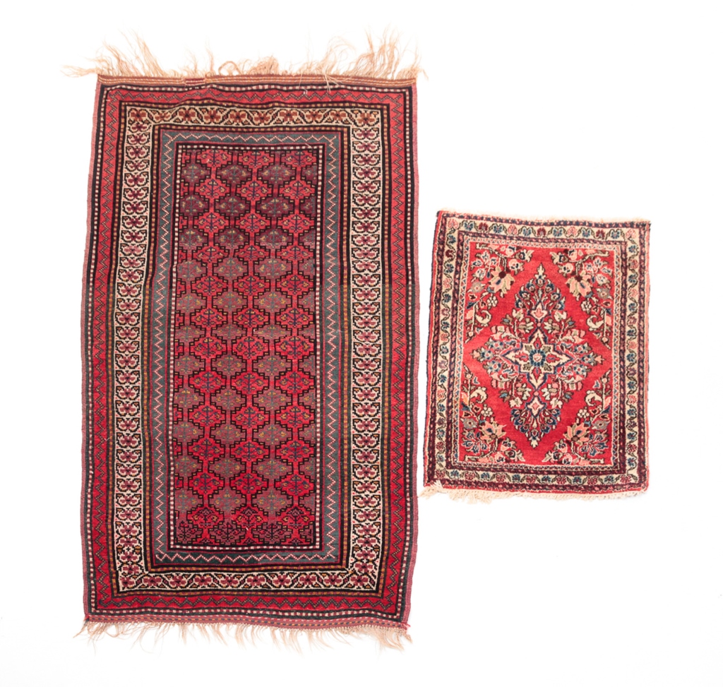 Appraisal: Twentieth century wool An area rug red field and geometric