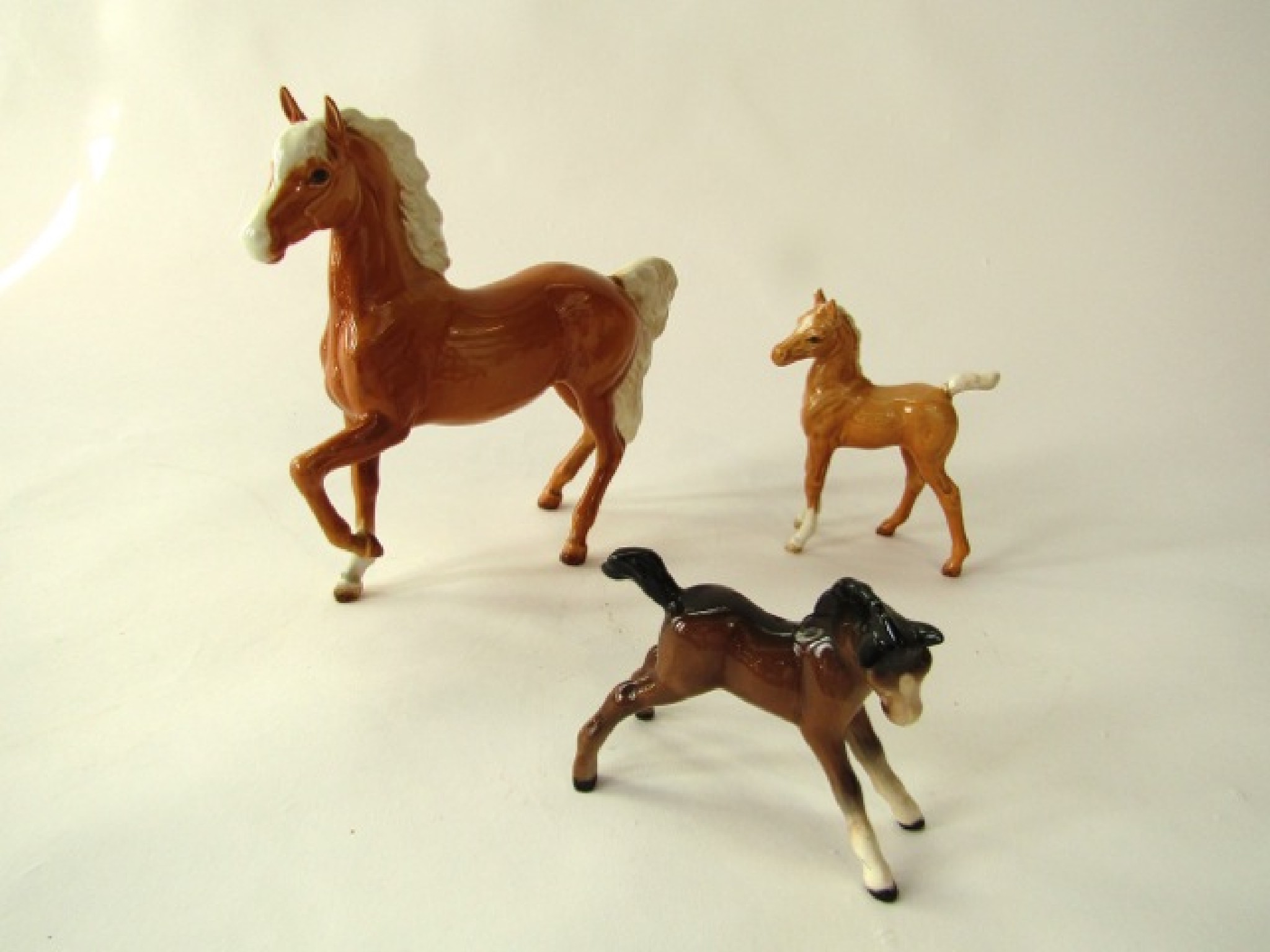 Appraisal: A Beswick model of a trotting Palomino horse together with