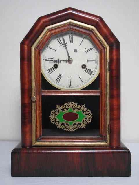 Appraisal: New Haven mahogany striking shelf clock Reverse painted glass on