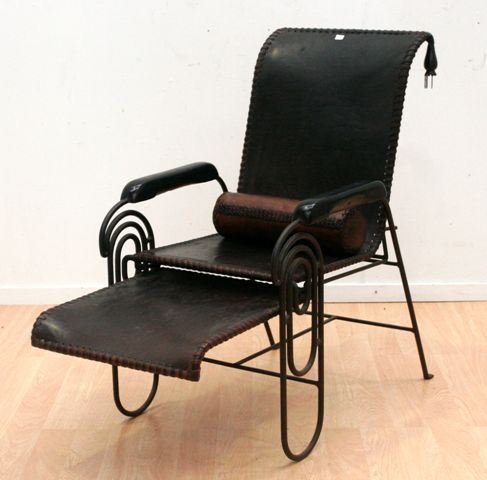 Appraisal: A French wrought iron and leather chair Circa s with