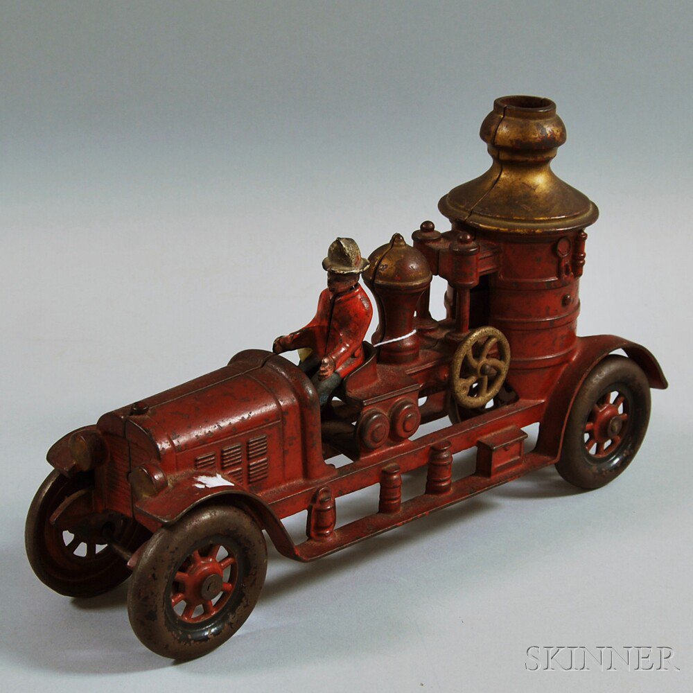 Appraisal: Antique Red-painted Cast Iron Fire Pumper Toy with seated fireman