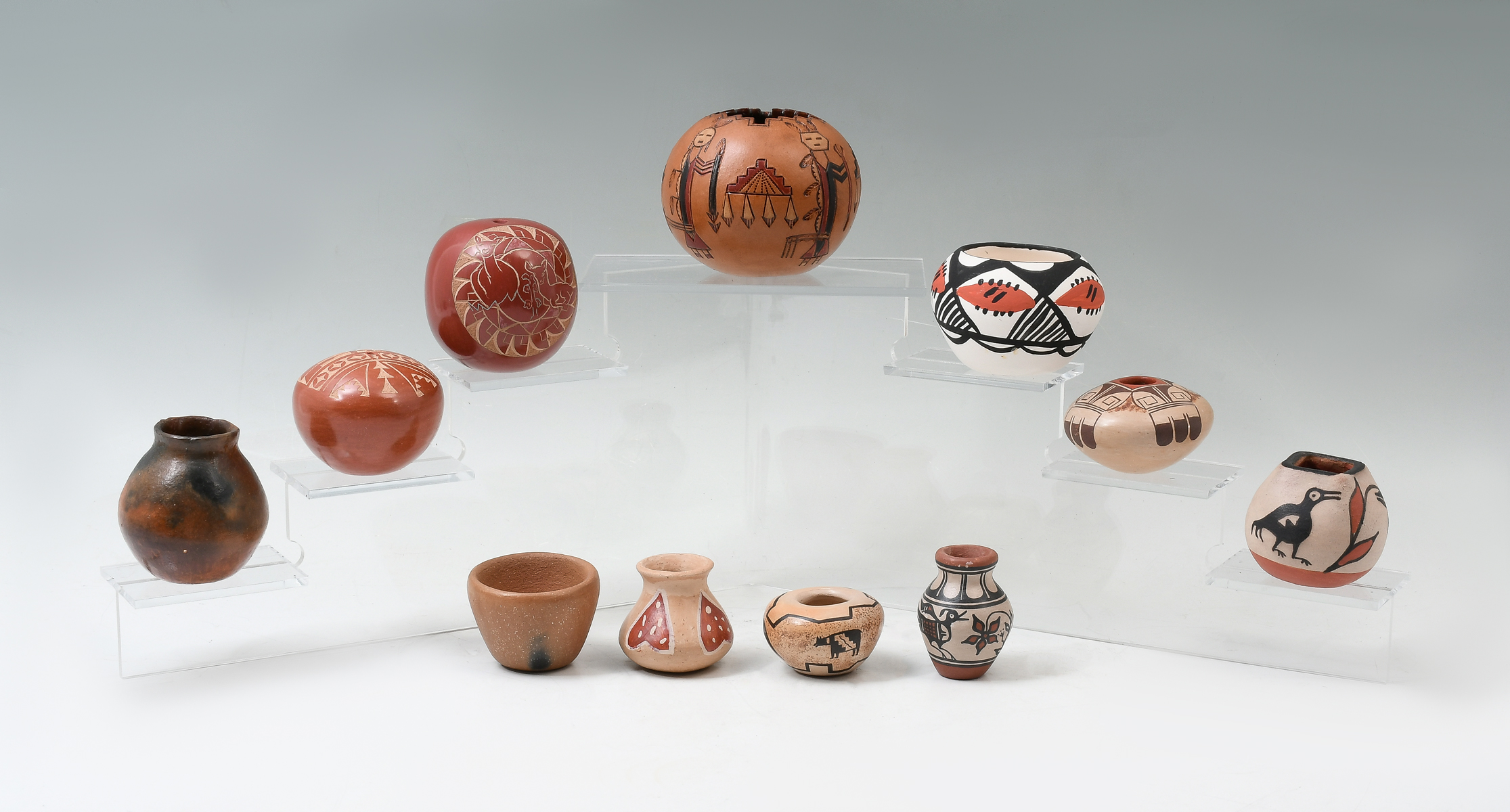 Appraisal: NATIVE AMERICAN MINIATURE POTTERY ITEMS items include Jemez Seed Jar